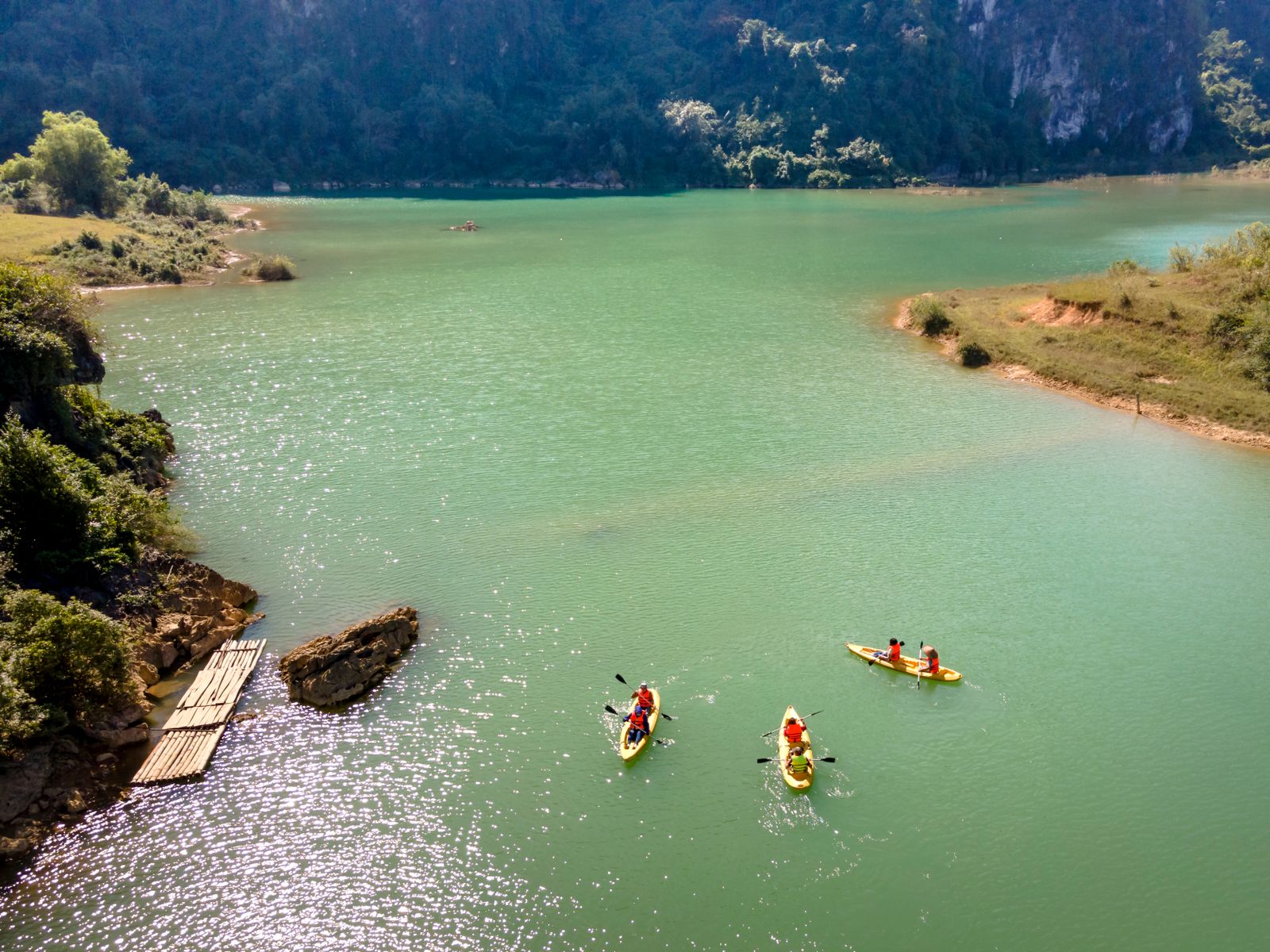 A family paddling on a calm Wisconsin lake