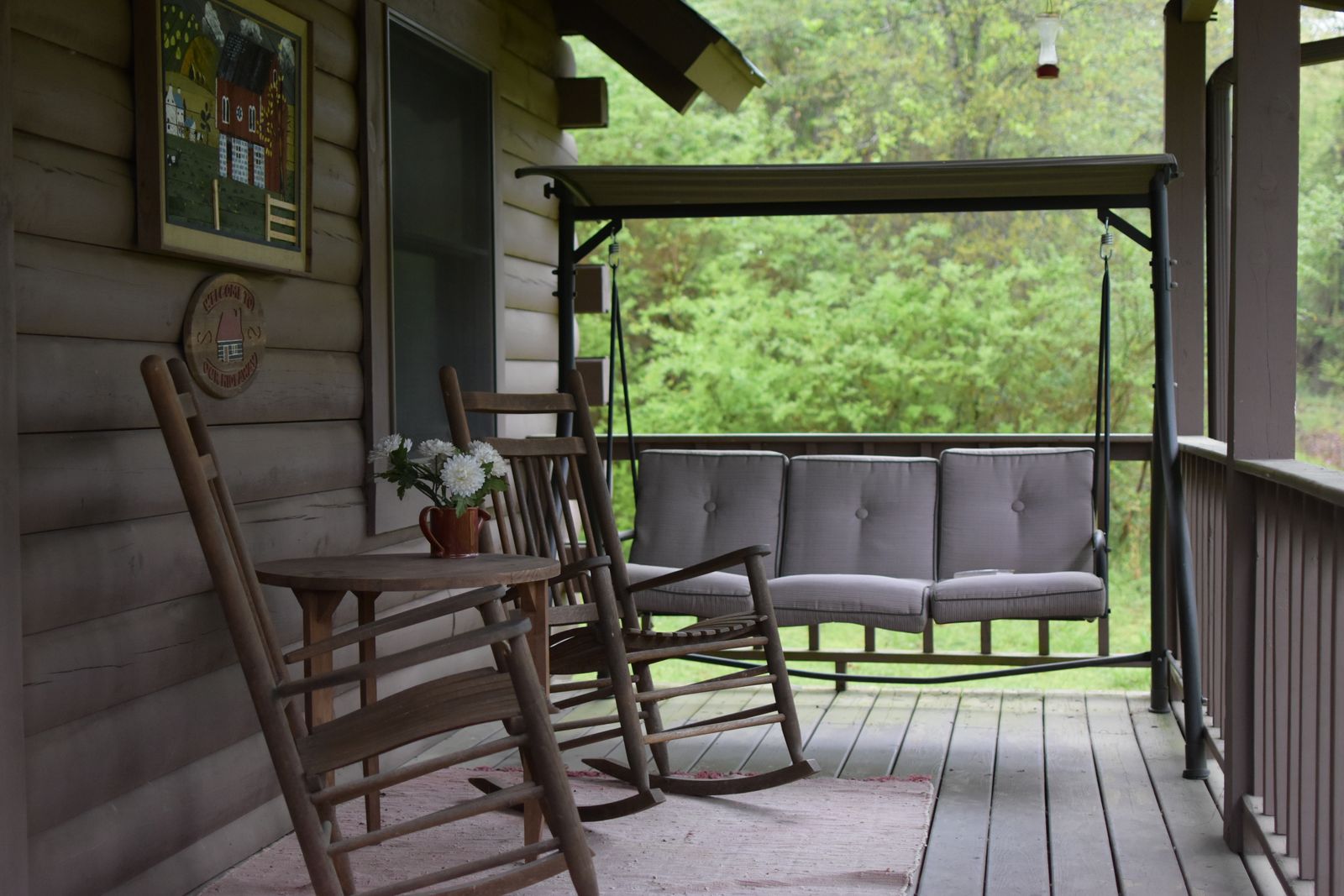 A covered porch looking out over the lake